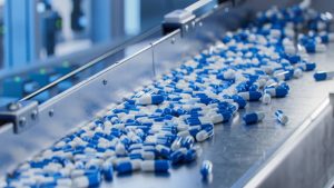 Pills being made during supplement manufacturing. 