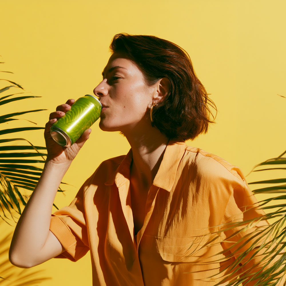 Woman drinking from can